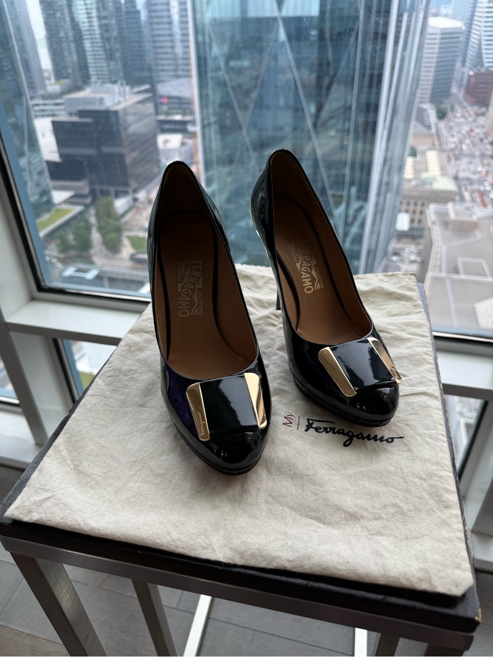 Salvatore Ferragamo Black Patent Pumps with Gold Buckle